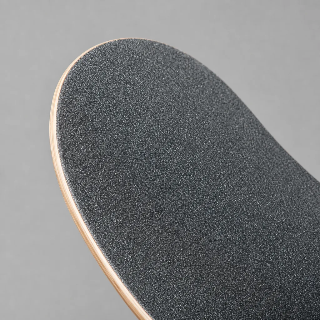 Fresh grip tape on a Minority skateboard deck